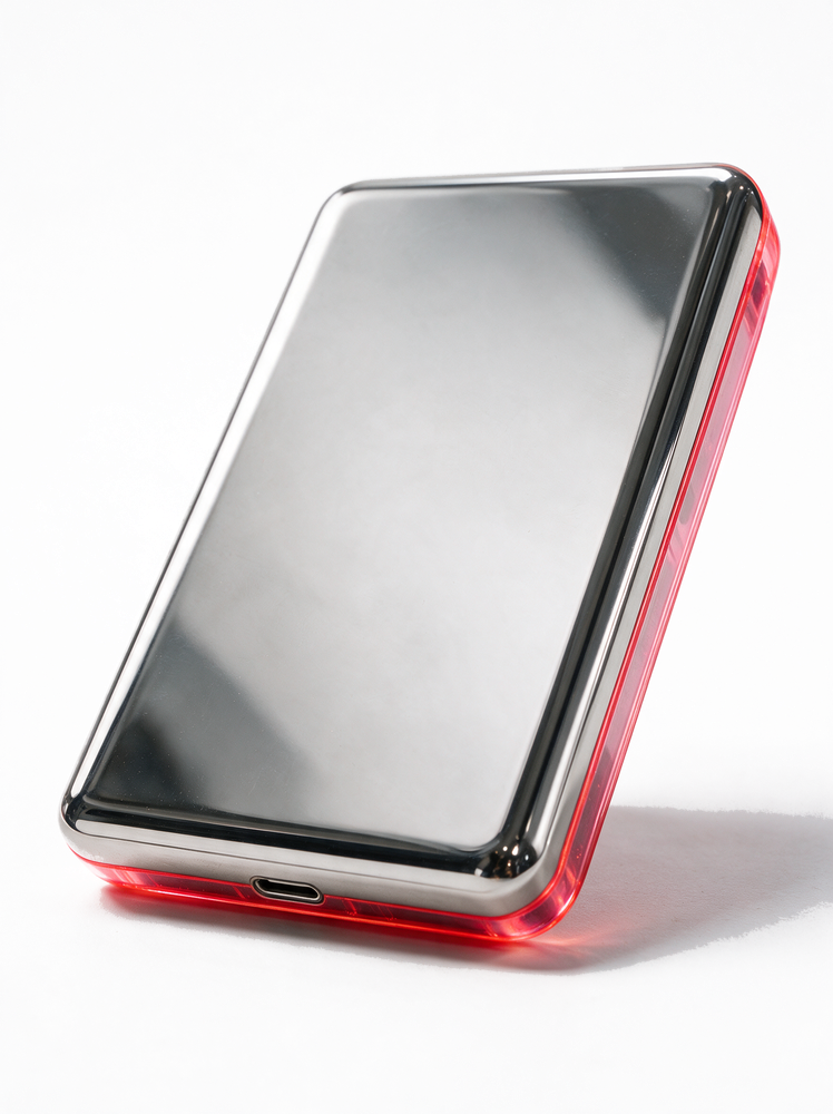 Static &mdash; polished stainless back, translucent neon pink iPod Classic.